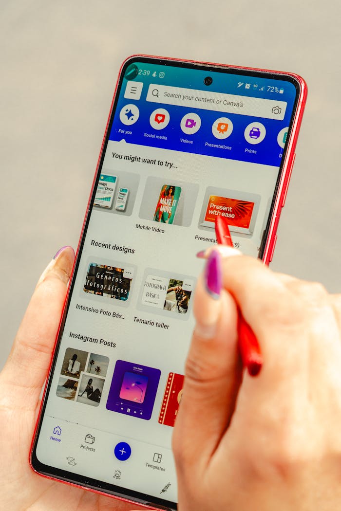 A person holding a samsung galaxy note 10 with a red pen